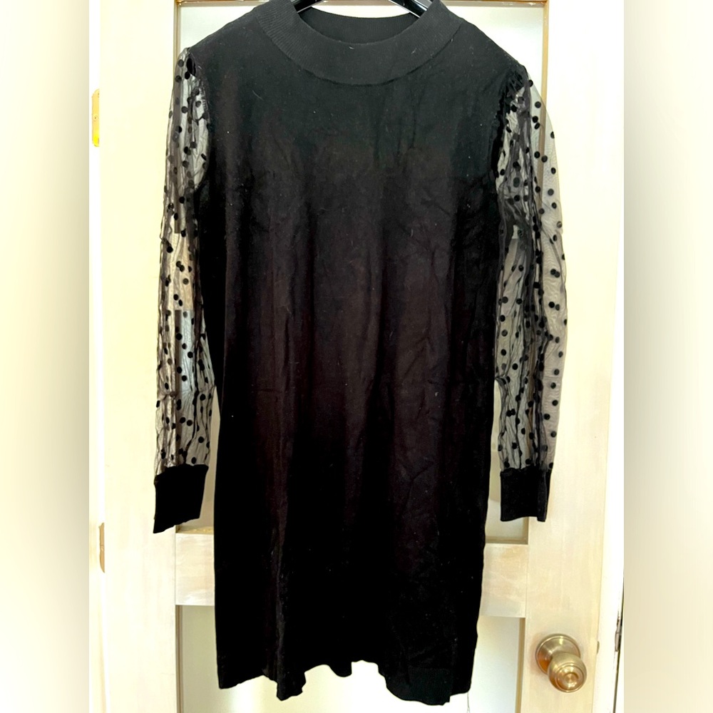 Black sweater dress with sheer polka dot sleeves